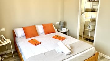 4 habitaciones, tabla de planchar con plancha y acceso a internet