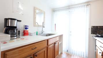 Microwave, coffee/tea maker, toaster, cookware/dishes/utensils