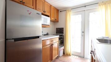 Microwave, coffee/tea maker, toaster, cookware/dishes/utensils