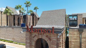 A brick archway with the name "Marisol" and "1700 Gulf Blvd" indicating the hotel's location. - Relax in Coastal 2-Bedroom Beachfront Comfort (South Padre Island)