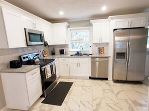 Microwave, oven, stovetop, dishwasher - Stone Mountain Getaway- 3 bedroom ranch house (Stone Mountain)