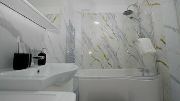 Hair dryer, towels, soap, toilet paper