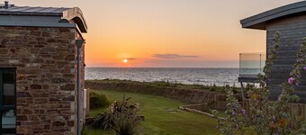 The Beacon is a five bedroomed terraced seafront retreat with incredible views of Widemouth Bay. It