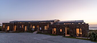 The Beacon is a five bedroomed terraced seafront retreat with incredible views of Widemouth Bay. It