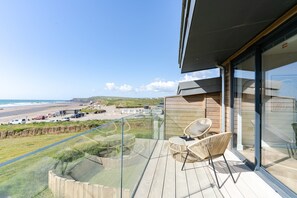 Terrace/patio - The Beacon is a five bedroomed terraced seafront retreat with incredible views of Widemouth Bay. It (Widemouth Bay)