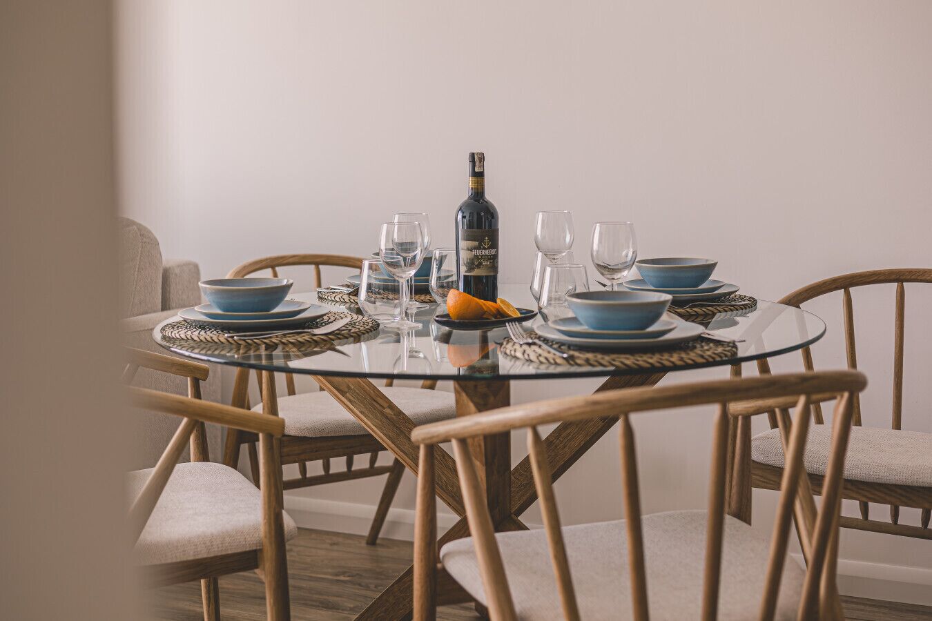 Modern glass dining table – perfect for a seaside apartment breakfast experience