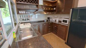 Fridge, dishwasher, coffee/tea maker, dining tables