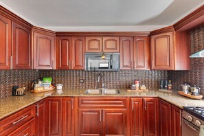 Fridge, microwave, stovetop, coffee/tea maker
