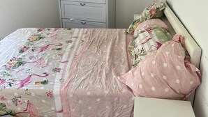 A bedroom with a bed, a nightstand, and a dresser. - Studio 2 steps from Saint Charles station (Unknown)