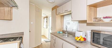 Refrigerador, horno, parrilla de estufa y tostadora