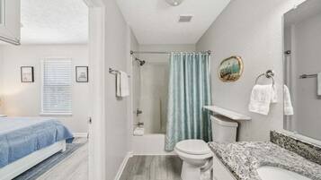 Shower, hair dryer, towels, shampoo