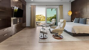 Un dormitorio moderno con una cama grande, televisor y vistas a una piscina y colinas.
