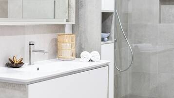 Shower, eco-friendly toiletries, hair dryer, towels