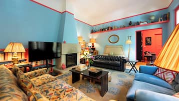 Deluxe Villa, Garden View | Living area | 50-inch flat-screen TV with cable channels