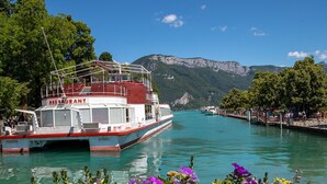 A boat with a restaurant named "RESTAURANT" docked at a pier.