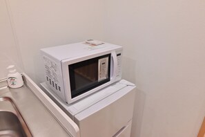 Comfort Quadruple Room, 2 Double Beds | Microwave