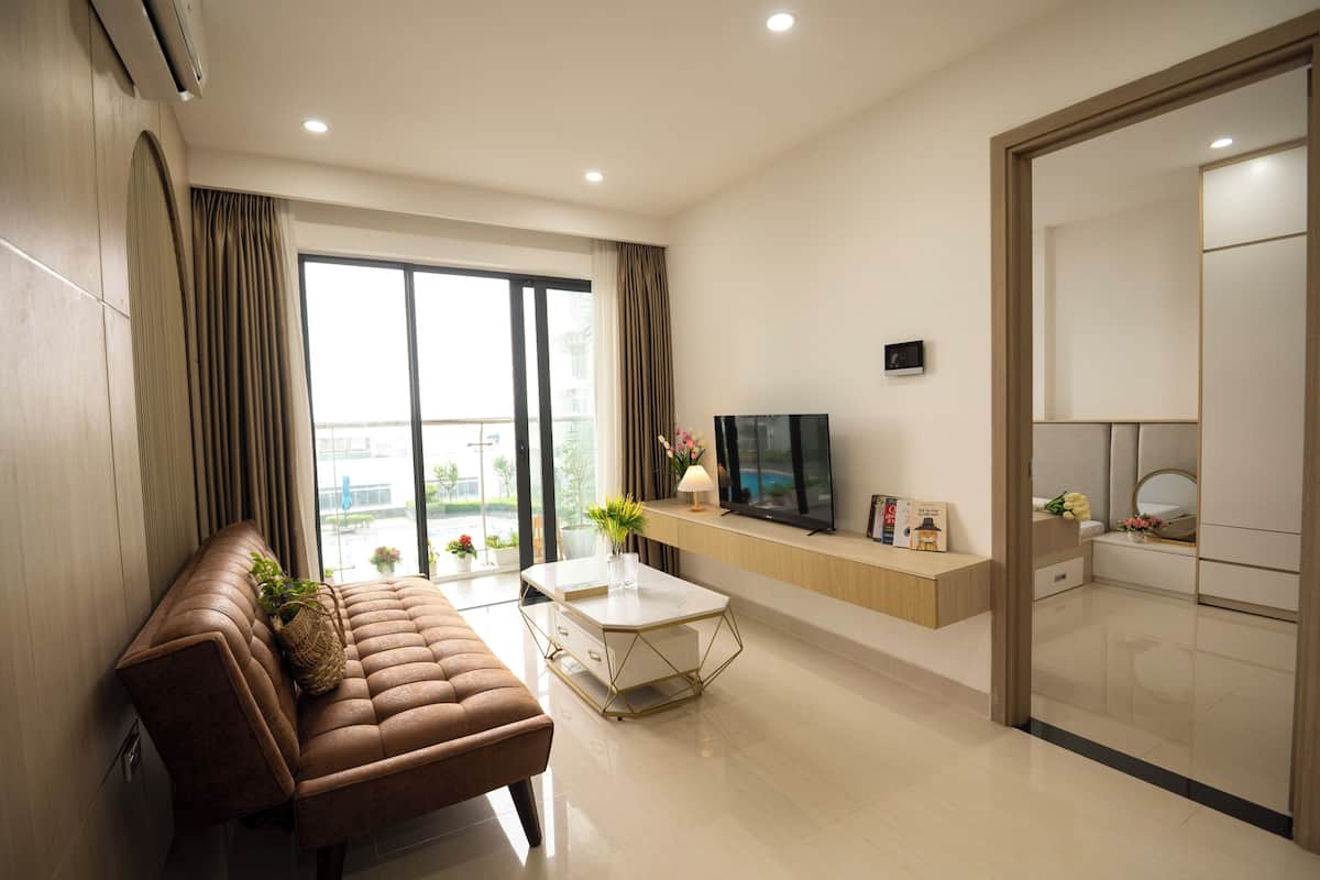 Junior Apartment, Balcony, Pool View | Living area | Flat-screen TV
