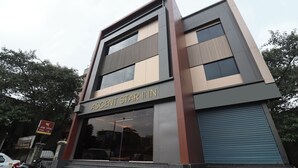 A modern building with the sign "ASCENT STAR INN" indicating a hotel. - Ascent Star Inn (Mumbai)