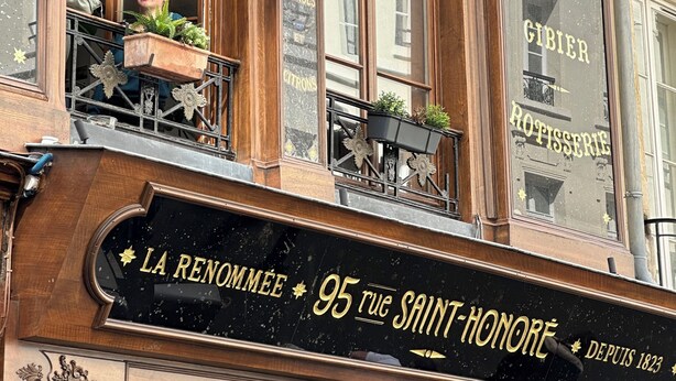 A storefront with a sign reading 'La Renommée 95 Rue Saint-Honoré' and 'Fruits & Vegetables.' - 1608 Saint-Honoré (Paris)
