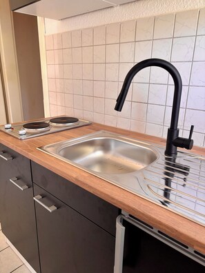 Fridge, microwave, stovetop, coffee/tea maker