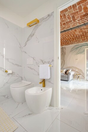 Shower, eco-friendly toiletries, hair dryer, bidet