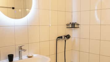 Shower, hair dryer, slippers, towels