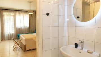 Twin Room, Courtyard View | Bathroom | Shower, hair dryer, towels, soap