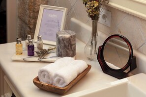 Hair dryer, towels, soap, toilet paper