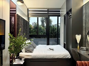 Departamento Deluxe, balcón, vista a la ciudad | Ropa de cama hipoalergénica, camas con efecto memoria y minibar