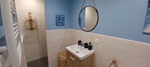 Shower, hair dryer, towels, toilet paper