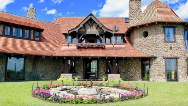 A stone building with a prominent gabled roof and a stone chimney. - Peaceful Meredith Getaway - 2 BR w/ Wifi & Charm (Meredith)