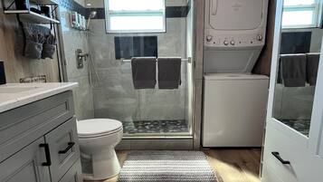 Shower, hair dryer, towels, soap
