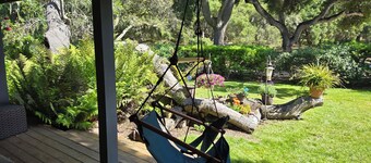 Charming quiet single story home amongst coast live oak trees in gated community
