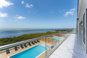 Outdoor pool, a heated pool - NEW LUXURY 4,000 SF Waterfront Home w/Pool , Sleeps 20 (Port Isabel)