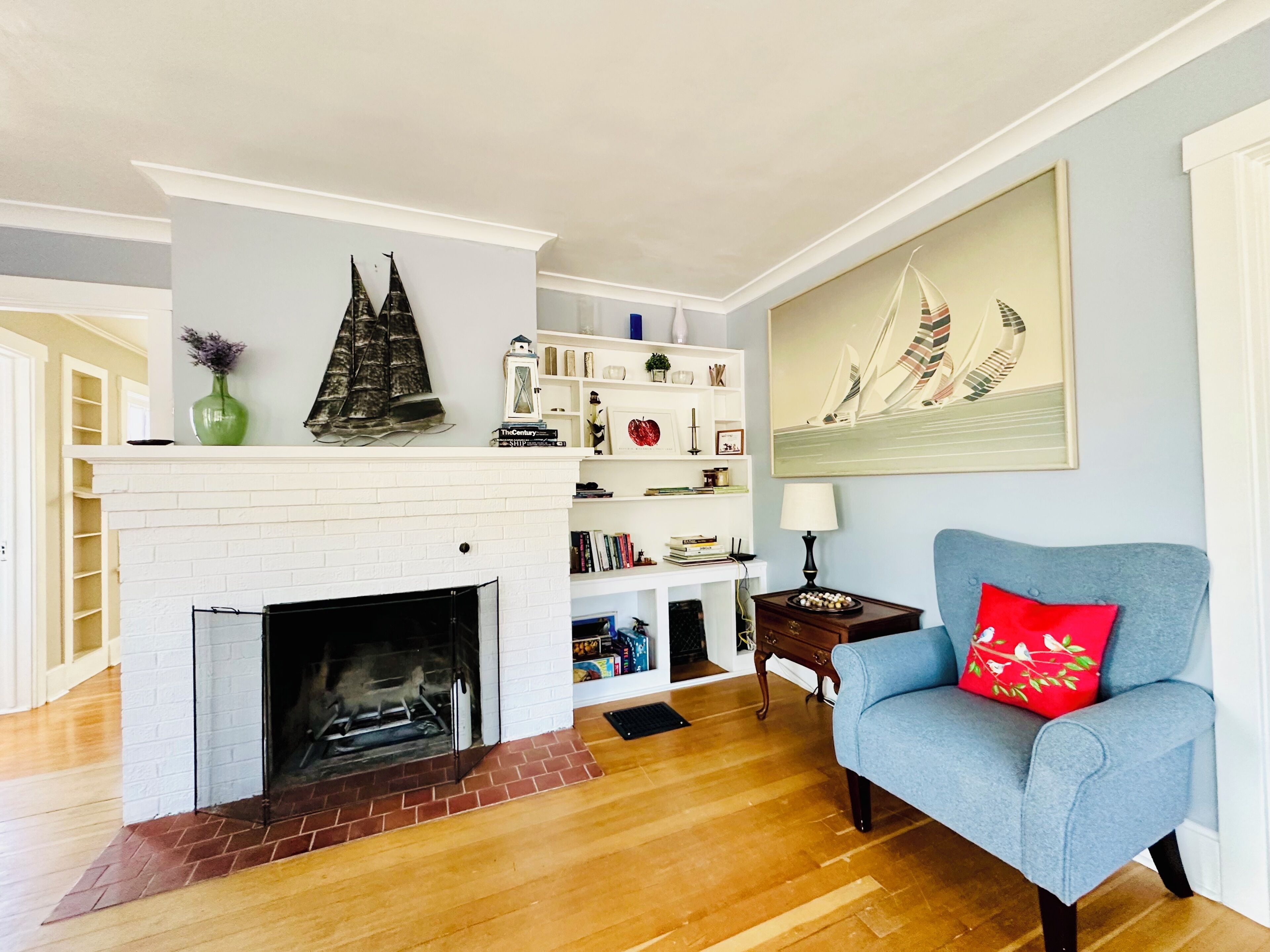 Reading nook by the decorative fireplace for cozy and laid back afternoons.