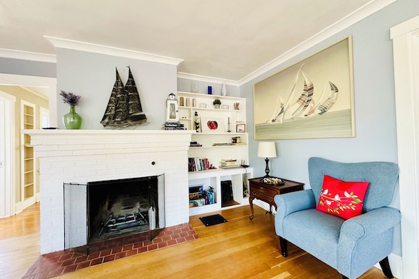 Reading nook by the decorative fireplace for cozy and laid back afternoons.