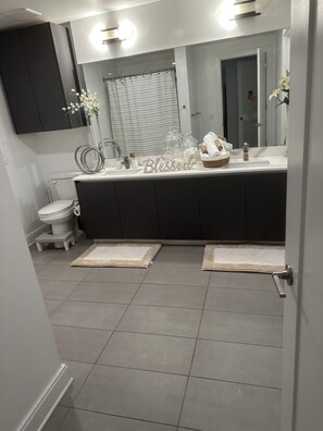 Shower, towels, soap, toilet paper