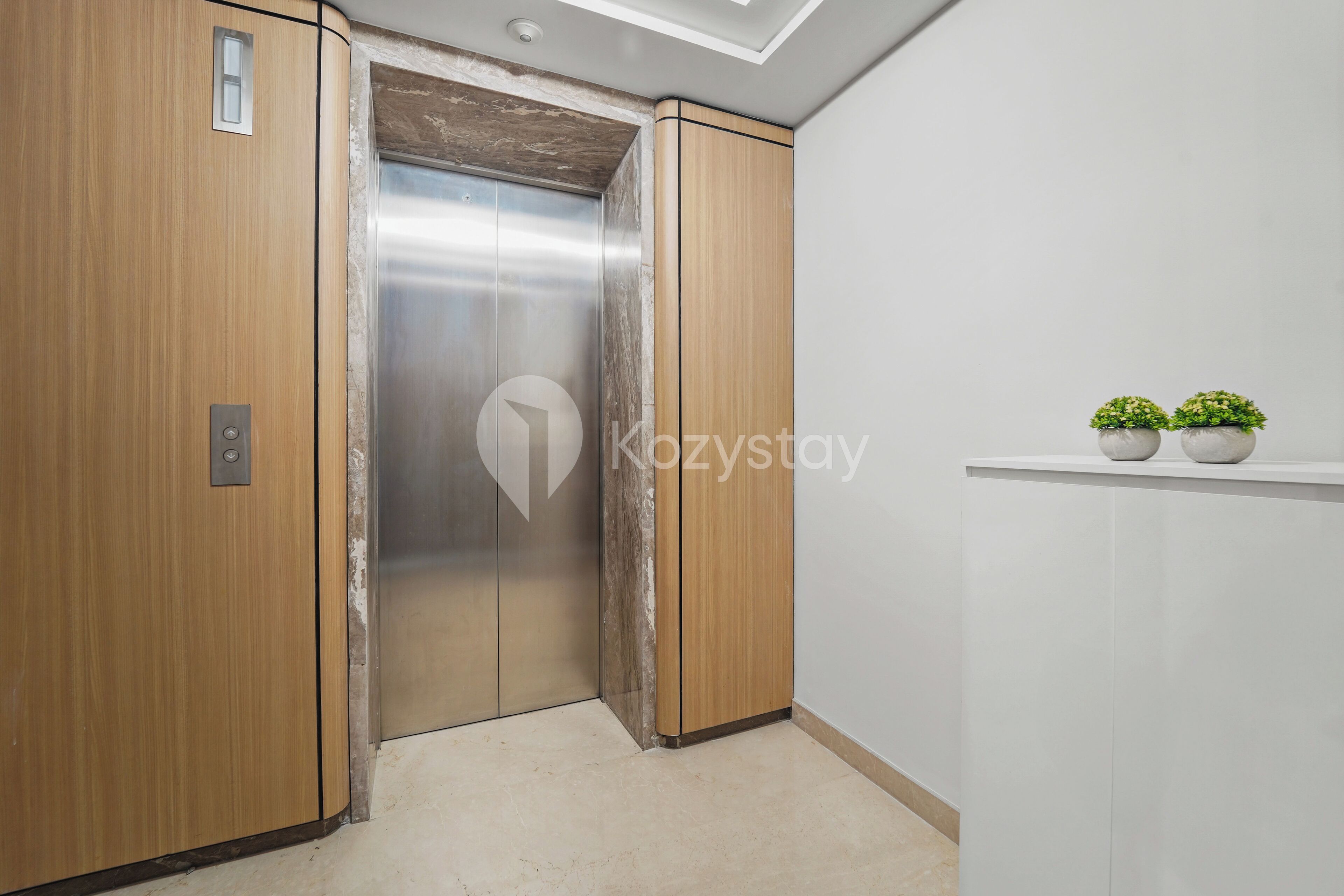 An elevator with wooden paneling and a modern design.