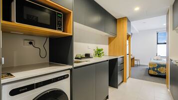 Fridge, microwave, stovetop, cookware/dishes/utensils