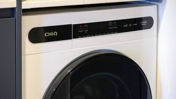 A front view of a CHiQ washing machine with a digital display and various washing options.