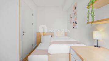 A modern, minimalist bedroom with a single bed, bedside tables, and a wall-mounted shelf with a plant.
