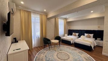 Deluxe Suite, City View | Premium bedding, minibar, in-room safe, desk