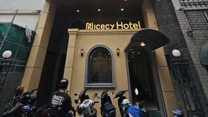 A hotel entrance with a sign reading "Nicecy Hotel". - Nicecy Hotel - Truong Quyen (Ho Chi Minh City)