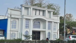 A large, white building with arched windows and a central entrance. - Moonvilla Banquet And Hotels (Phulpur)