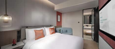 Deluxe Suite, Courtyard View | Desk, laptop workspace, blackout curtains, iron/ironing board