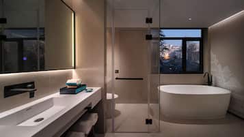Deluxe Room, Bathtub, City View | Bathroom | Designer toiletries, hair dryer, slippers, towels