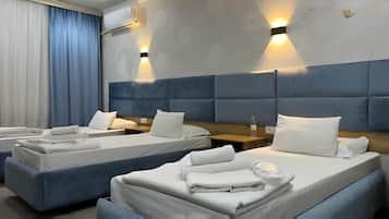 Standard Triple Room, City View | Iron/ironing board