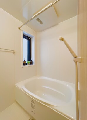 Designer toiletries, hair dryer, slippers, electronic bidet