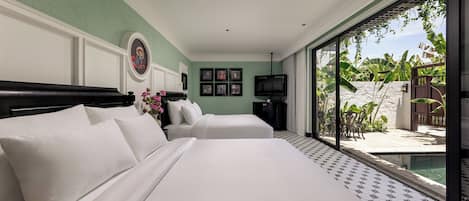 A hotel room with a large bed, two bedside tables, a television, and a view of a pool and outdoor area.