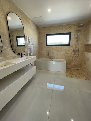 Shower, towels, soap, toilet paper